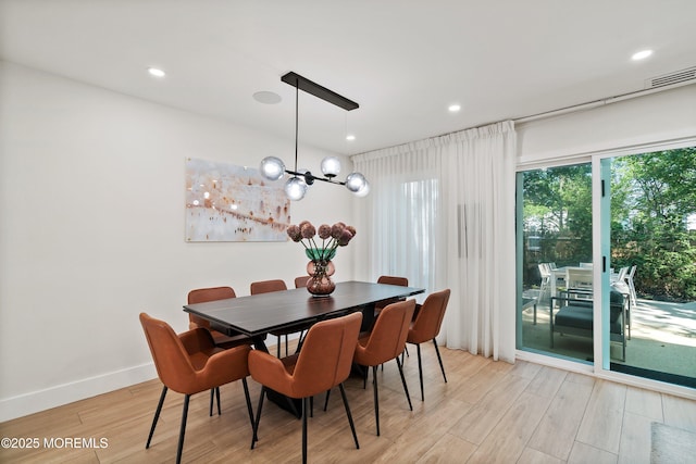 144 Colony Cir, Lakewood, NJ 08701 - dining area featuring light wood-type flooring, a chandelier, and recessed lighting