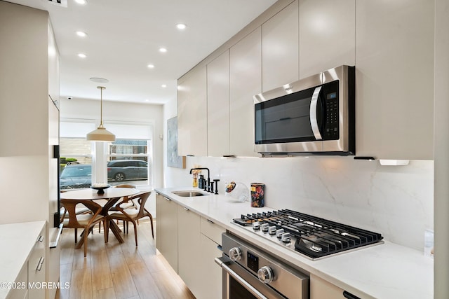 144 Colony Cir, Lakewood, NJ 08701 - kitchen with stainless steel appliances, recessed lighting, tasteful backsplash, hanging light fixtures, and modern cabinets