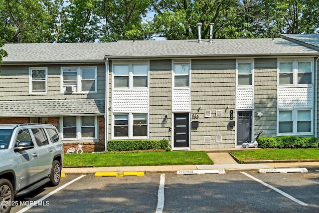 144 Colony Cir, Lakewood, NJ 08701 - view of front of property featuring uncovered parking, roof with shingles, and cooling unit