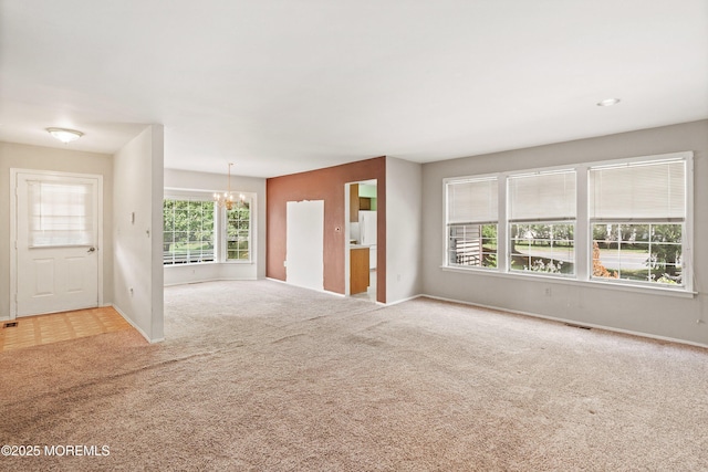 153D Concordia Cir, Monroe, NJ 08831 - unfurnished living room featuring carpet and a chandelier