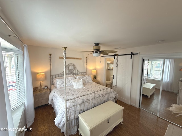 57 Albert Dr, Beach Haven West, NJ 08050 - bedroom featuring a barn door, wood finished floors, and ceiling fan