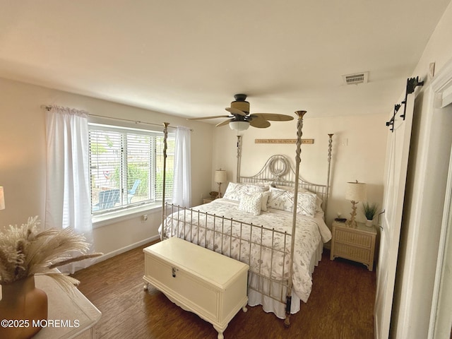 57 Albert Dr, Beach Haven West, NJ 08050 - bedroom featuring a barn door, dark wood-style floors, and a ceiling fan