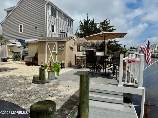 57 Albert Dr, Beach Haven West, NJ 08050 - wooden terrace featuring a storage unit and outdoor dining area