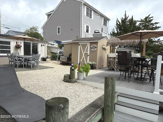 57 Albert Dr, Beach Haven West, NJ 08050 - view of patio / terrace featuring outdoor dining area, a storage unit, and a deck