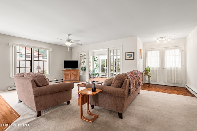 628A Stamford Ct, Manchester, NJ 08759 - living room with baseboard heating, ceiling fan, light colored carpet, and french doors