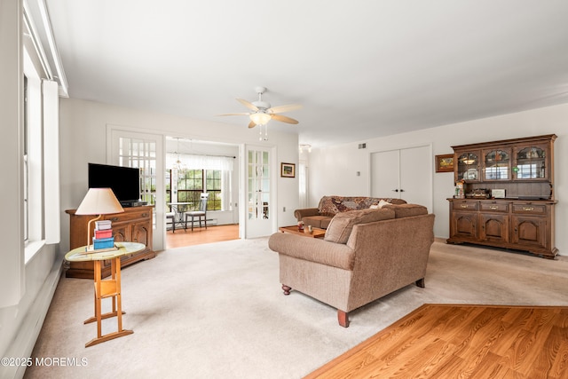 628A Stamford Ct, Manchester, NJ 08759 - living area featuring ceiling fan, light colored carpet, light wood-type flooring, and baseboard heating