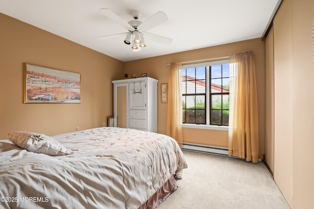 628A Stamford Ct, Manchester, NJ 08759 - bedroom with a baseboard heating unit, light carpet, and ceiling fan