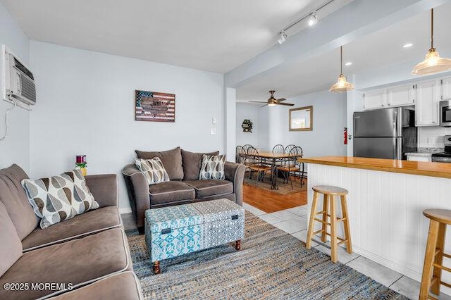 202 Lincoln Ave Unit C5, Seaside Heights, NJ 08751 - living area featuring a ceiling fan, rail lighting, and light tile patterned flooring