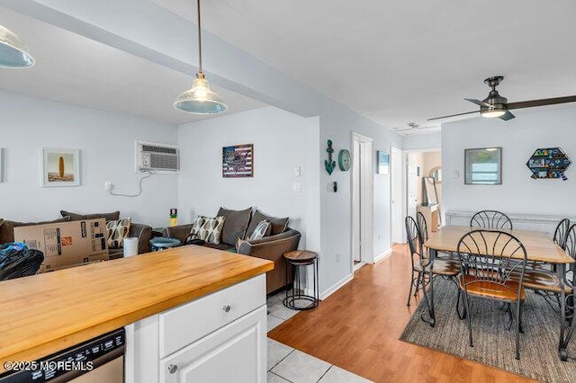 202 Lincoln Ave Unit C5, Seaside Heights, NJ 08751 - dining area with a wall mounted AC, ceiling fan, and light tile patterned flooring