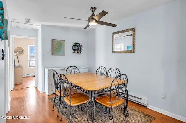 202 Lincoln Ave Unit C5, Seaside Heights, NJ 08751 - dining area featuring light wood-style floors, a baseboard heating unit, a ceiling fan, and baseboard heating
