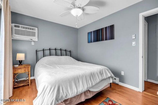 202 Lincoln Ave Unit C5, Seaside Heights, NJ 08751 - bedroom with wood finished floors, a ceiling fan, and a wall mounted AC