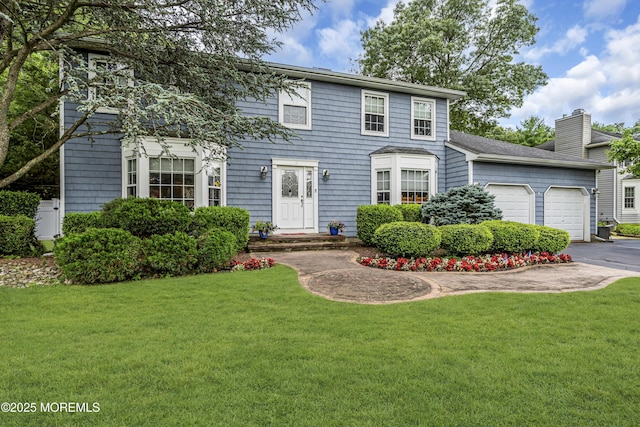16 Bridge Ct, Jackson, NJ 08527 - colonial inspired home featuring a garage, a front yard, a chimney, and asphalt driveway