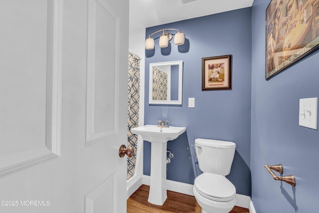 16 Bridge Ct, Jackson, NJ 08527 - bathroom with wood finished floors and a shower with curtain