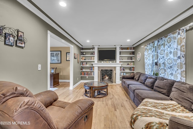 16 Bridge Ct, Jackson, NJ 08527 - living room featuring ornamental molding, recessed lighting, light wood finished floors, a fireplace with flush hearth, and built in shelves