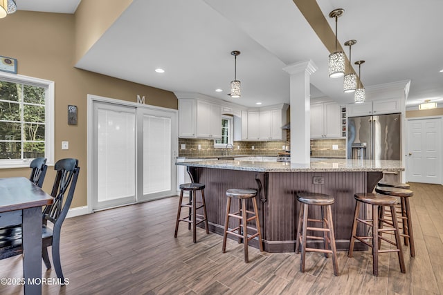 16 Bridge Ct, Jackson, NJ 08527 - kitchen with light wood-style floors, tasteful backsplash, plenty of natural light, white cabinetry, and recessed lighting