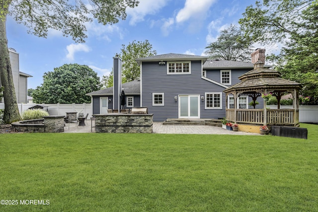 16 Bridge Ct, Jackson, NJ 08527 - rear view of property featuring a fire pit, a chimney, a gazebo, and a patio