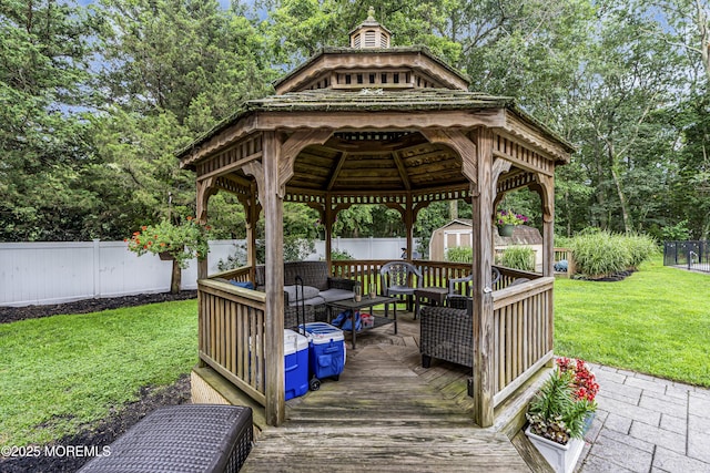 16 Bridge Ct, Jackson, NJ 08527 - wooden deck with a storage shed, a fenced backyard, an outdoor living space, a gazebo, and view of wooded area