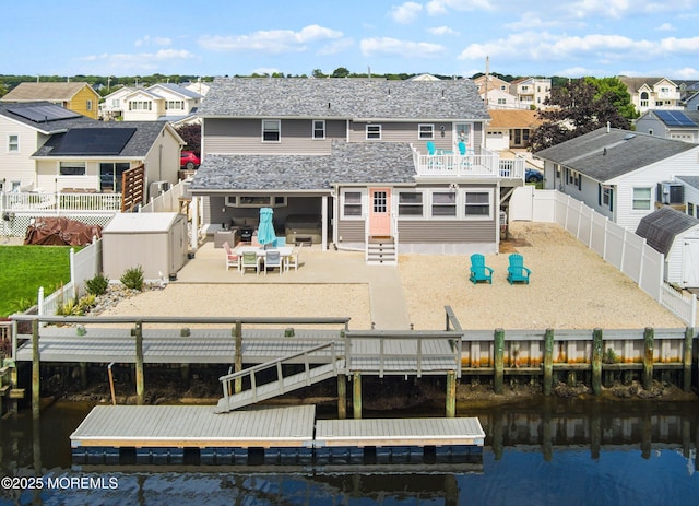 8 S Boston Dr, Little Egg Harbor, NJ 08087 - rear view of house with a residential view, a fenced backyard, and a water view