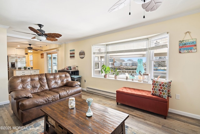 8 S Boston Dr, Little Egg Harbor, NJ 08087 - living area with a ceiling fan, a baseboard radiator, ornamental molding, healthy amount of natural light, and light wood-style floors