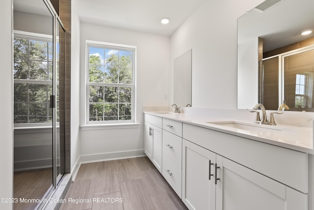 102 Pilot St, Marlboro, NJ 07746 - bathroom with double vanity, a stall shower, and recessed lighting