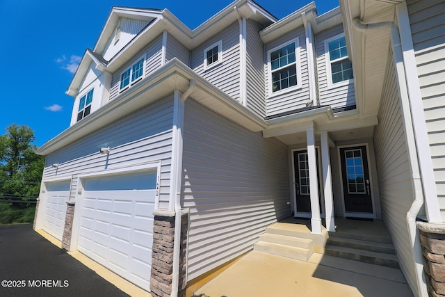102 Pilot St, Marlboro, NJ 07746 - property entrance featuring driveway and an attached garage