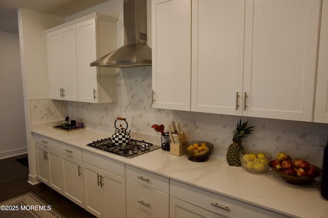 102 Pilot St, Marlboro, NJ 07746 - kitchen with wall chimney range hood, stainless steel gas stovetop, white cabinets, and light countertops