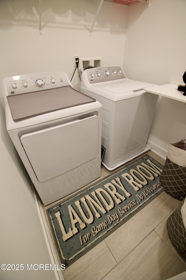 102 Pilot St, Marlboro, NJ 07746 - laundry room featuring independent washer and dryer and wood finished floors