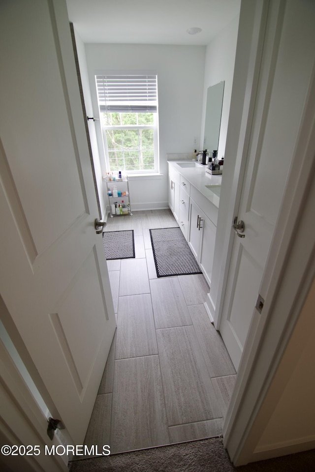 102 Pilot St, Marlboro, NJ 07746 - full bath with double vanity and wood tiled floors