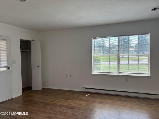 21 Yorkshire Ct Unit A, Manchester, NJ 08759 - unfurnished bedroom with baseboard heating, wood finished floors, and a closet