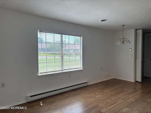 21 Yorkshire Ct Unit A, Manchester, NJ 08759 - spare room featuring a baseboard heating unit, a chandelier, and wood finished floors