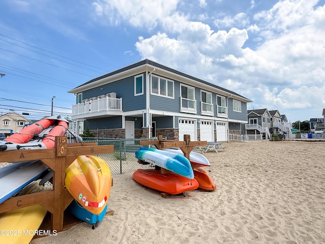 3365 Heron Ln, Lavallette, NJ 08735 - view of front facade featuring stone siding and a garage