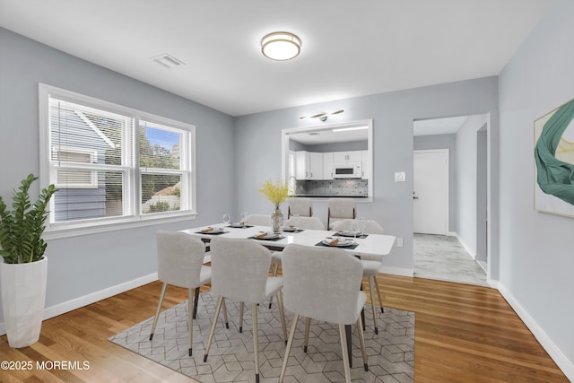 292 Washington Rd, Sayreville, NJ 08872 - dining space with light wood-style floors