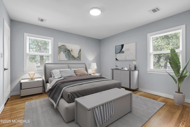 292 Washington Rd, Sayreville, NJ 08872 - bedroom featuring multiple windows and light wood finished floors