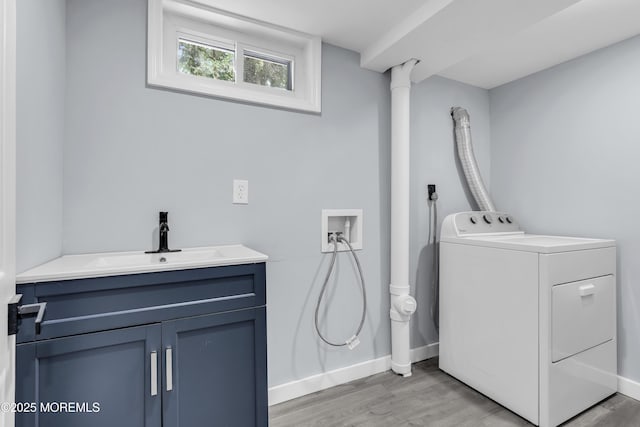 292 Washington Rd, Sayreville, NJ 08872 - laundry area with washer / clothes dryer, light wood-type flooring, and cabinet space