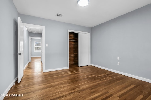 292 Washington Rd, Sayreville, NJ 08872 - unfurnished bedroom featuring attic access, wood finished floors, and a closet
