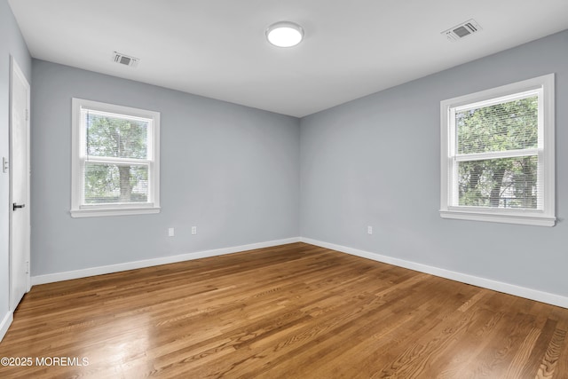 292 Washington Rd, Sayreville, NJ 08872 - unfurnished room with healthy amount of natural light and wood finished floors