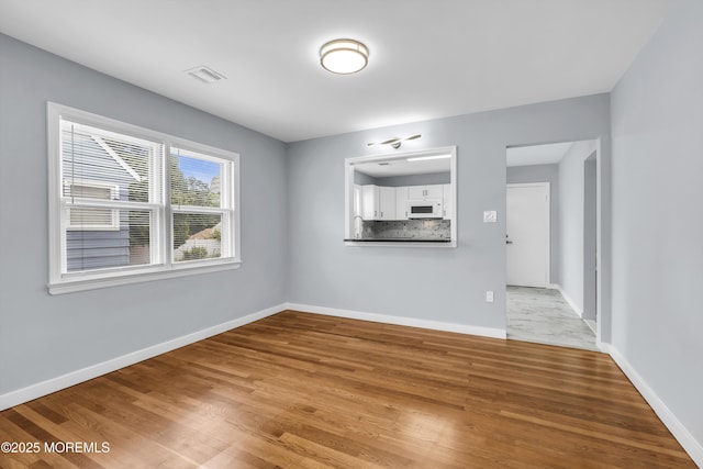 292 Washington Rd, Sayreville, NJ 08872 - unfurnished living room with wood finished floors
