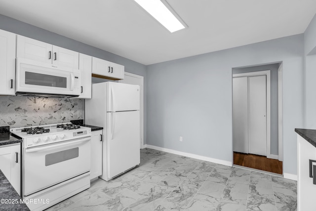 292 Washington Rd, Sayreville, NJ 08872 - kitchen featuring white appliances, light marble finish floors, dark countertops, and white cabinets