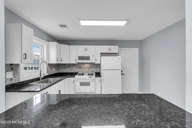 292 Washington Rd, Sayreville, NJ 08872 - kitchen with white appliances, dark stone counters, white cabinets, and tasteful backsplash