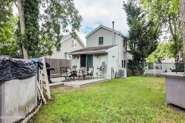 36 W Point Pleasant Ave, Ocean Gate, NJ 08740 - rear view of house featuring a fenced backyard and a wooden deck