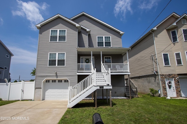 725 Prospect Ave, Union Beach, NJ 07735 - view of front facade with stairway, a garage, concrete driveway, a porch, and a gate