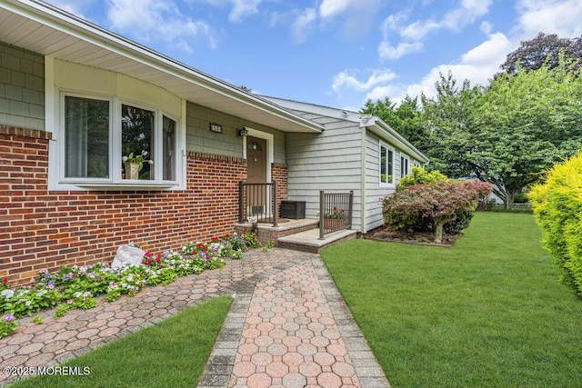 53 Edison Ave, Tinton Falls, NJ 07724 - doorway to property featuring a lawn and brick siding