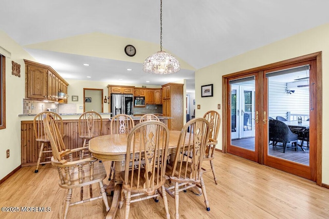 53 Edison Ave, Tinton Falls, NJ 07724 - dining area with light wood finished floors, a chandelier, lofted ceiling, french doors, and recessed lighting