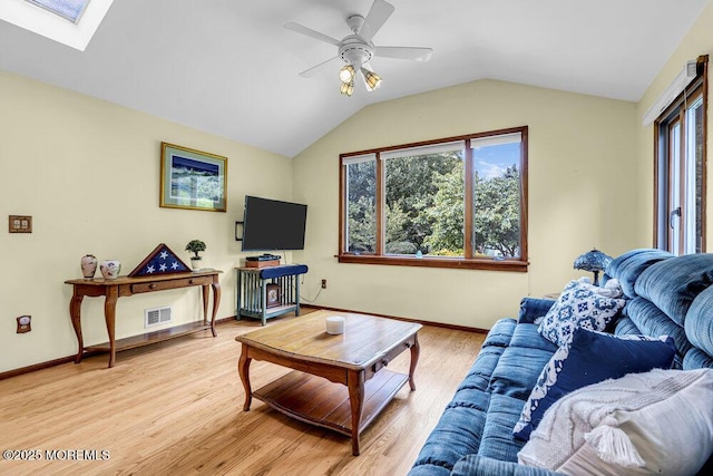 53 Edison Ave, Tinton Falls, NJ 07724 - living room with ceiling fan, light wood-style flooring, vaulted ceiling, and a skylight