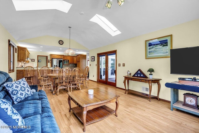 53 Edison Ave, Tinton Falls, NJ 07724 - living area featuring a skylight, light wood finished floors, and lofted ceiling