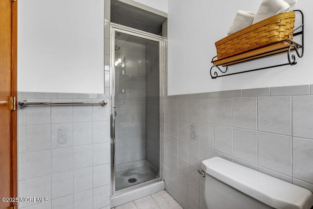 53 Edison Ave, Tinton Falls, NJ 07724 - full bathroom featuring tile walls, a stall shower, a wainscoted wall, and tile patterned flooring