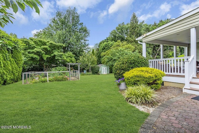 53 Edison Ave, Tinton Falls, NJ 07724 - view of green lawn featuring a storage unit
