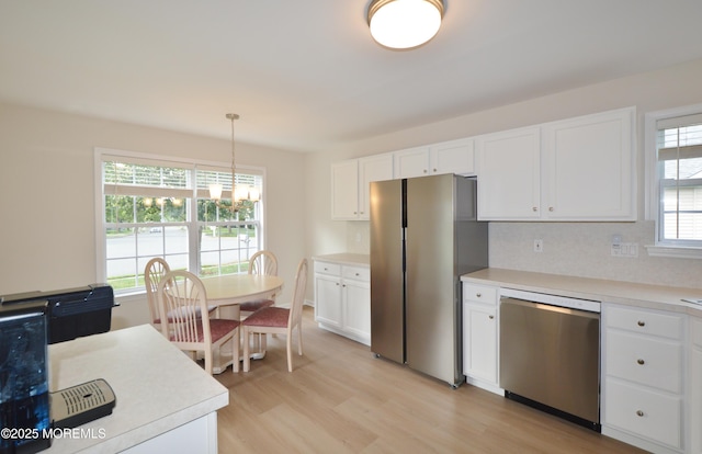 3229 Flagstone Ct, Toms River, NJ 08755 - kitchen featuring appliances with stainless steel finishes, light wood-style floors, white cabinetry, and light countertops