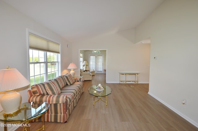 3229 Flagstone Ct, Toms River, NJ 08755 - living room featuring vaulted ceiling, wood finished floors, and french doors