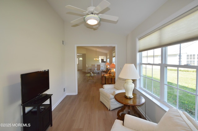 3229 Flagstone Ct, Toms River, NJ 08755 - living room featuring lofted ceiling, a ceiling fan, wood finished floors, and a chandelier
